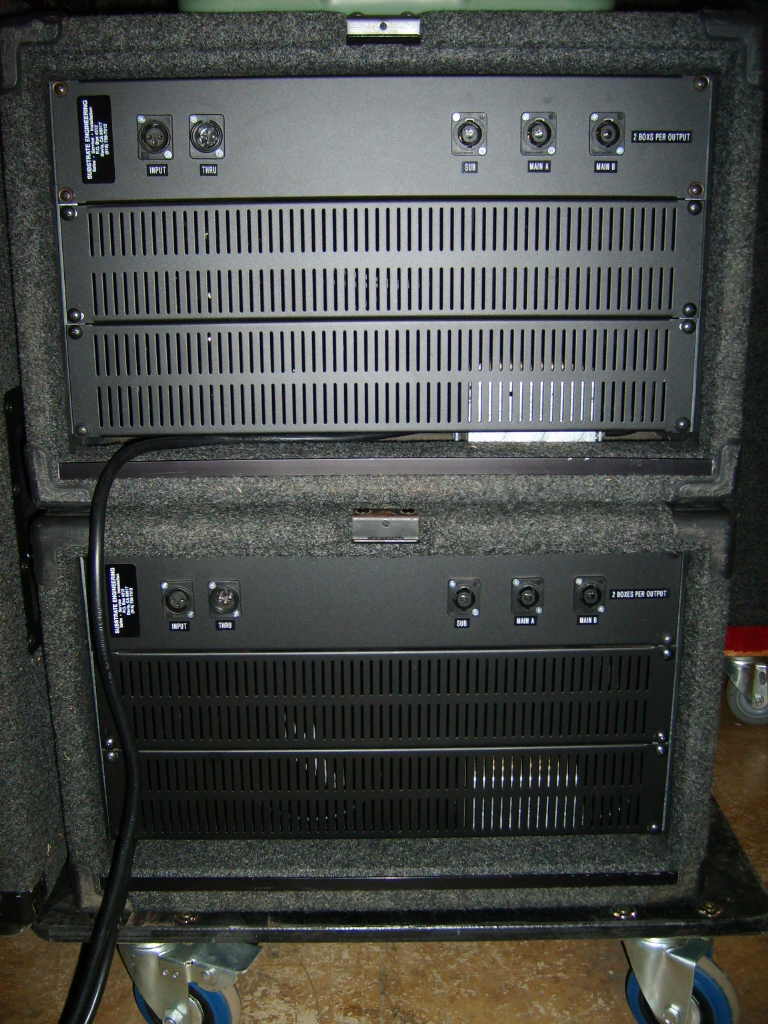 2 way plus subs line array amp racks back.JPG