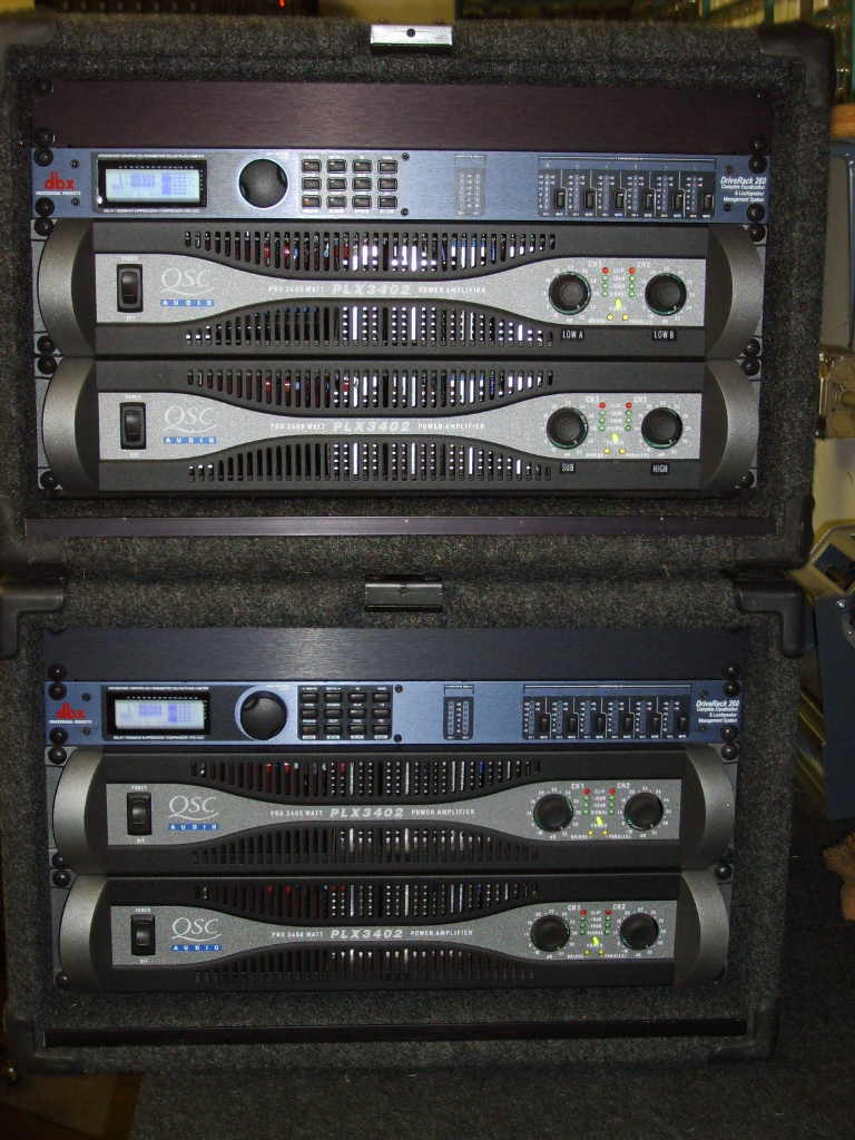 2 way plus subs line array amp racks front.JPG