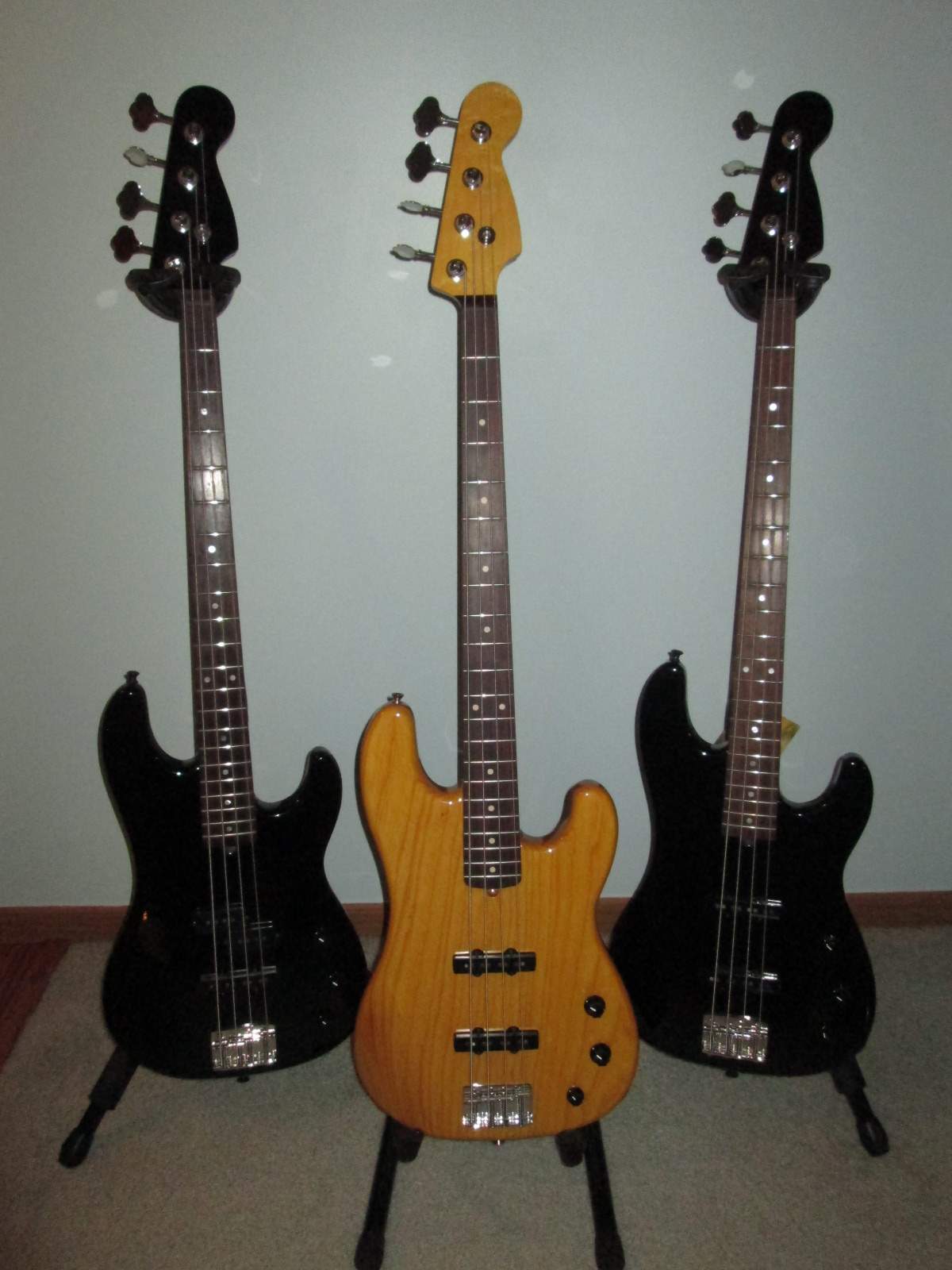 3 warmoth basses.JPG