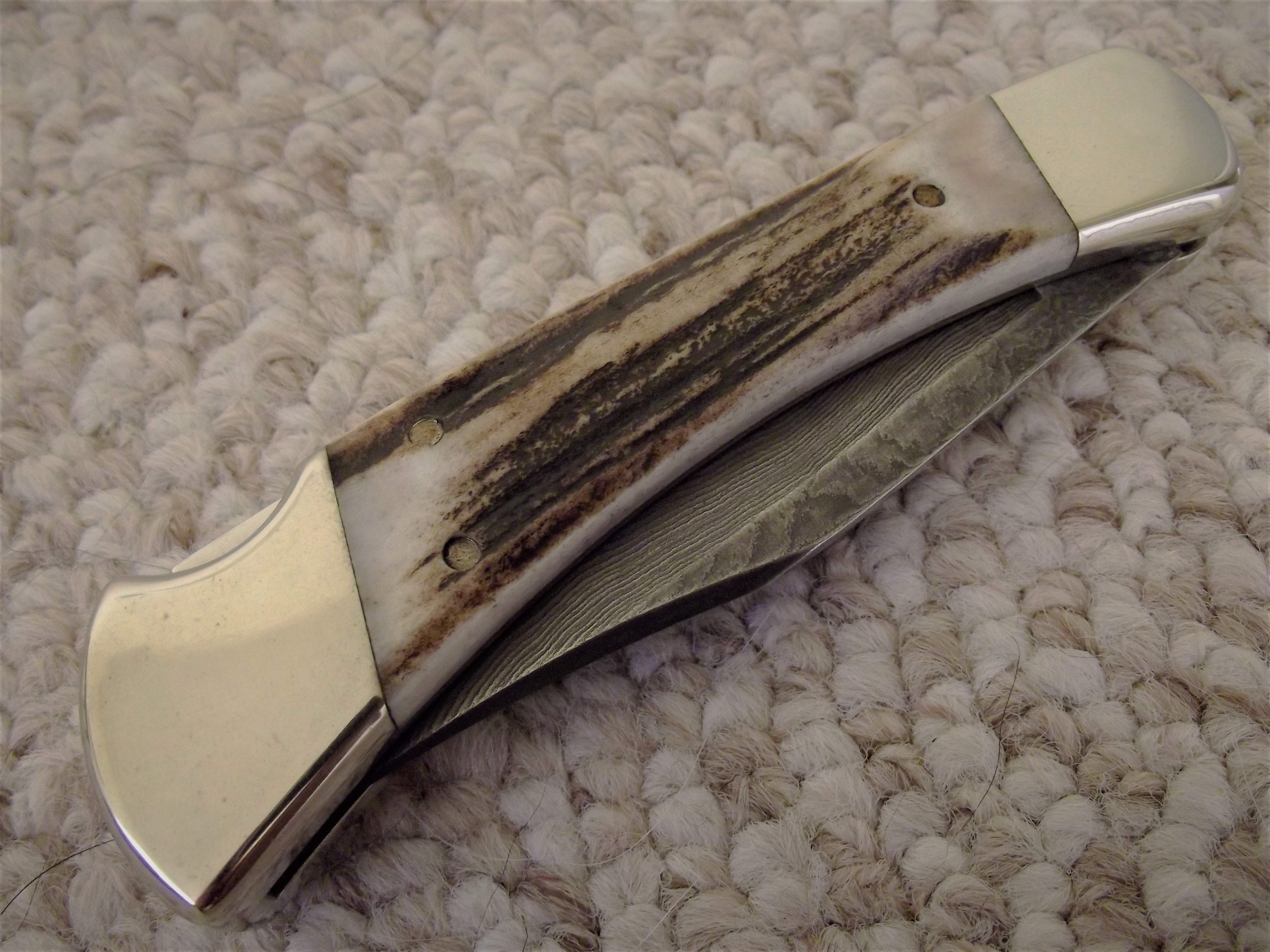 Buck 110 Damascus.JPG