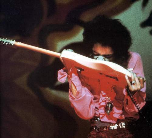 hendrix-playing-with-teeth.jpg