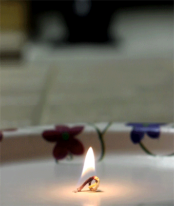 reverse-birthday-candle-is-super-cool.gif