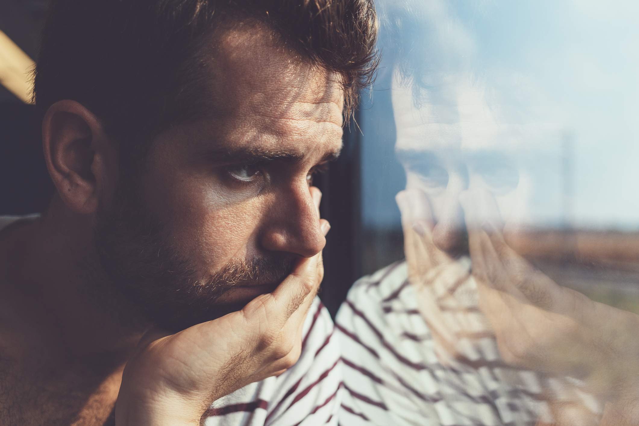 sad-man-looking-out-window.jpg