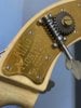 Headstock Brass.jpg