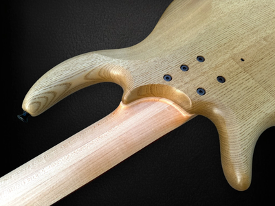 Elrick+EVO+5+Figured+Walnut+NECKJOINT-Photoroom.png