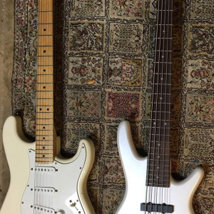 Ibanez GSRM 25 Mikro 5 Sting Bass Next to a Strat