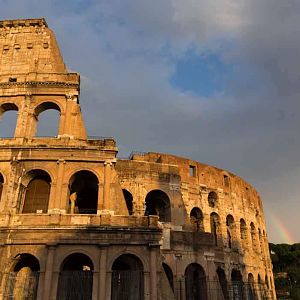 Colosseum in Rome by day with rainbow