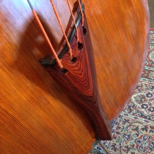 Bass tailpiece above