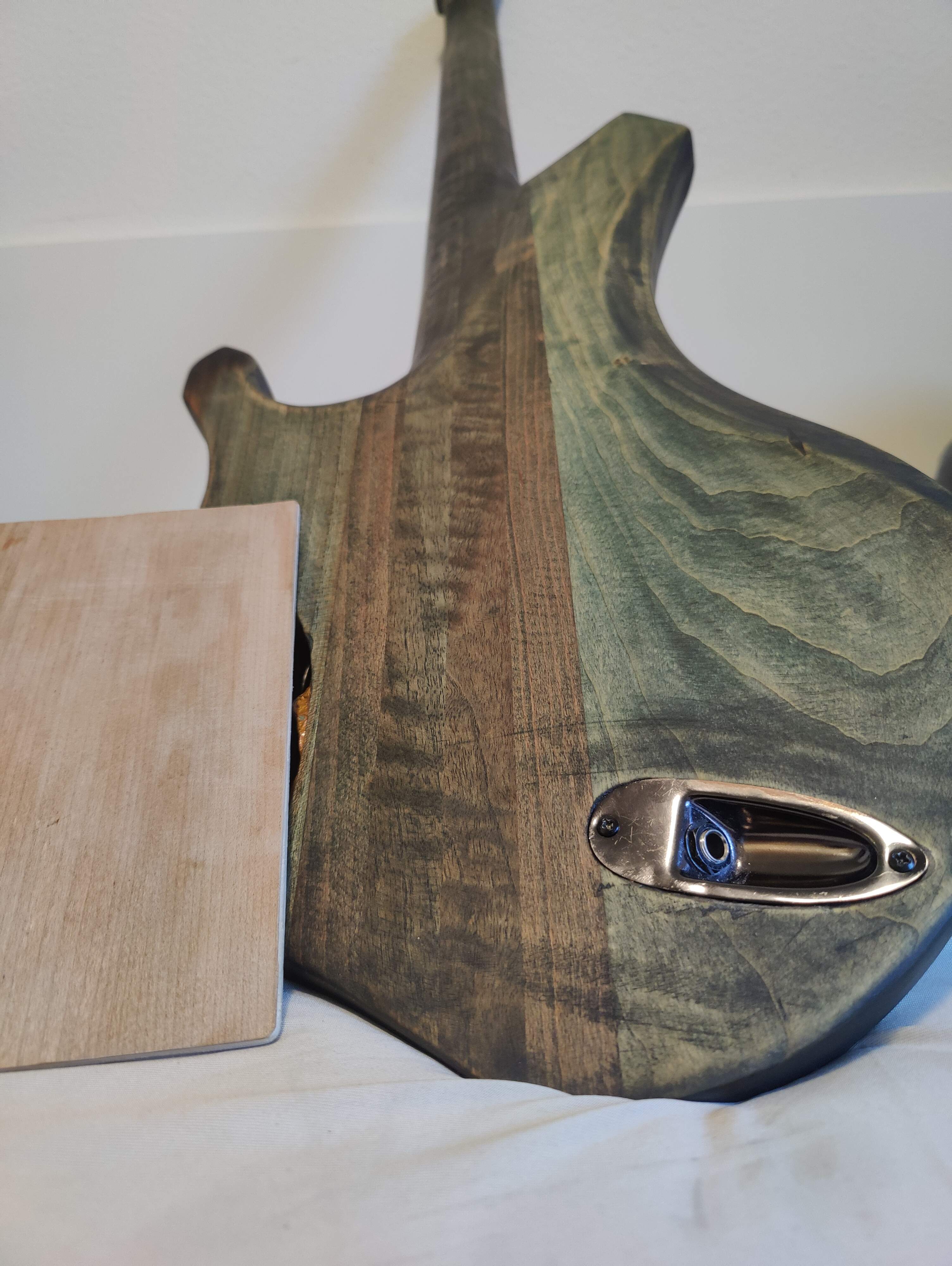 Unfinished back with electronics cavity material