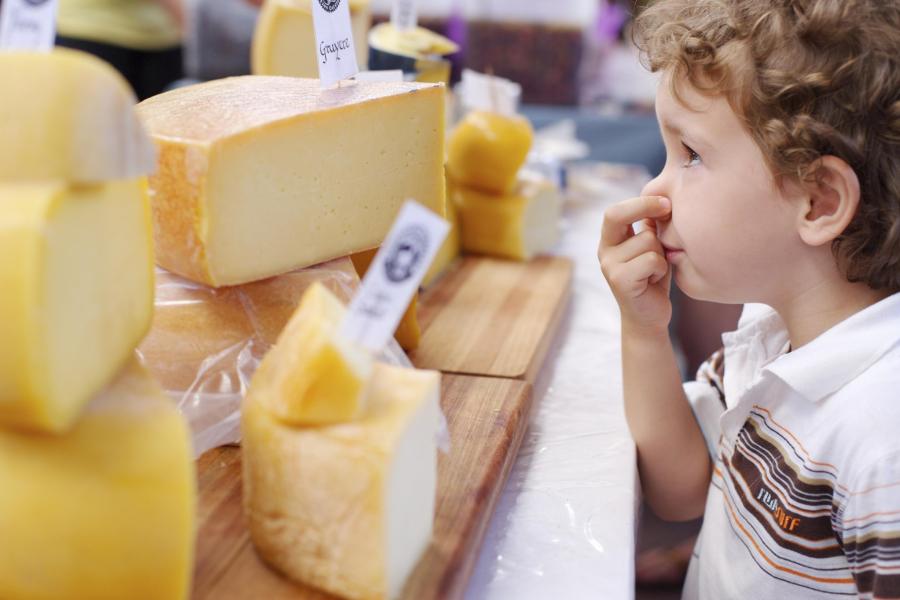 Boy-2-3-smelling-cheese-at-stall-prof.jpg