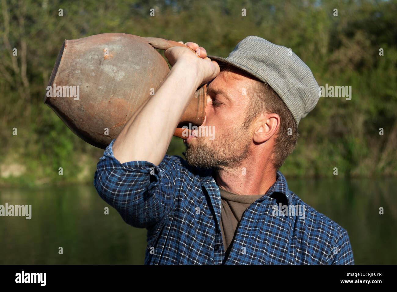 man-drinking-from-the-jug-RJF0YR.jpg