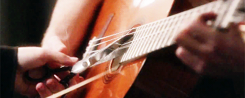 Samchel_cut_strings_rachel_sam_guitar.gif